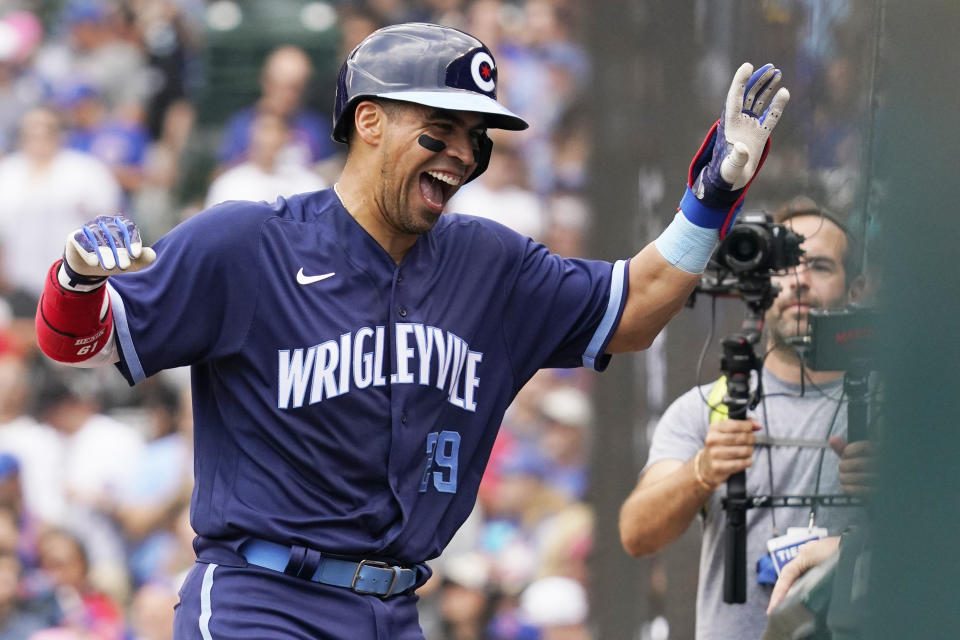 Chicago Cubs' Robinson Chirinos celebrates his solo home run as he walks to the dugout during the fourth inning of a baseball game against the Arizona Diamondbacks in Chicago, Friday, July 23, 2021. (AP Photo/Nam Y. Huh)