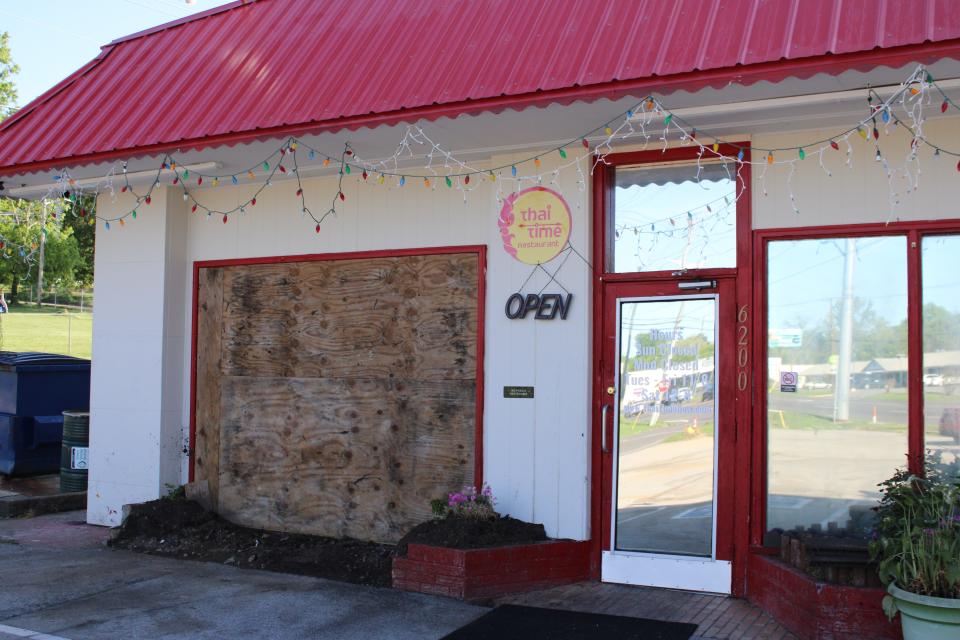 The front of Thai Time is boarded up after a car crashed into the restaurant on April 21.