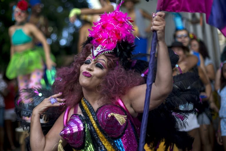 Revellers celebrate the street carnival parade of the "Loucura Suburbana" bloco in Rio de Janeiro, Brazil, on February 8, 2018