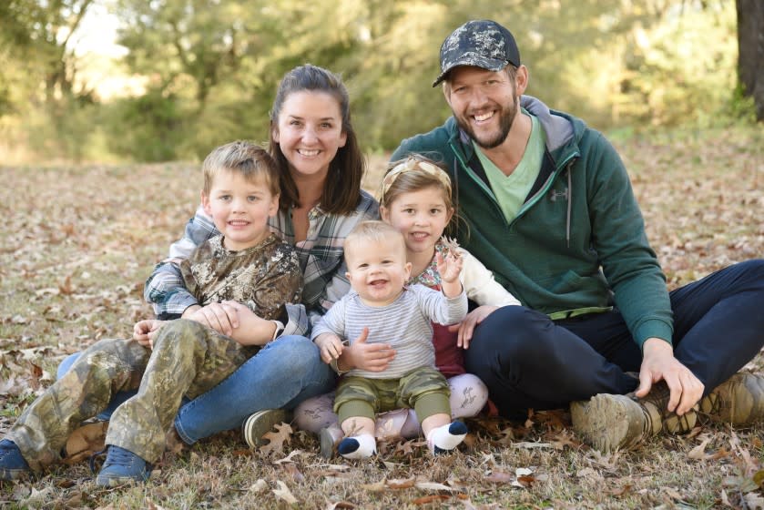 Dodger pitcher Clayton Kershaw with his wife, Ellen, and children (from L-R) Charley, Cooper, and Cali Ann.