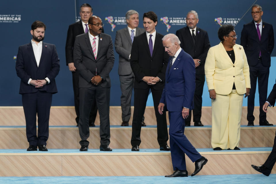 President Joe Biden walks to his place during a family photo at the Summit of the Americas, Friday, June 10, 2022, in Los Angeles. (AP Photo/Evan Vucci)