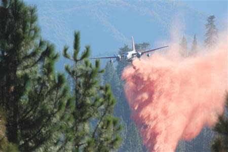 A tanker drops retardant on the Rim Fire in this undated United States Forest Service handout photo near Yosemite National Park, California, released to Reuters August 30, 2013. REUTERS/Mike McMillan/U.S. Forest Service/Handout via Reuters