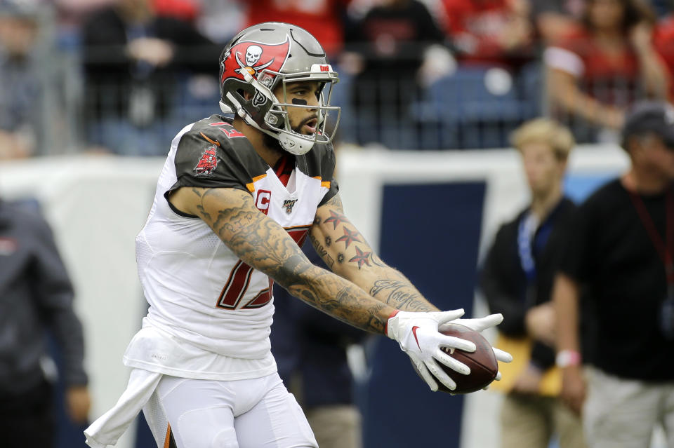 Tampa Bay Buccaneers wide receiver Mike Evans scores a touchdown against the Tennessee Titans in the first half of an NFL football game Sunday, Oct. 27, 2019, in Nashville, Tenn. (AP Photo/James Kenney)