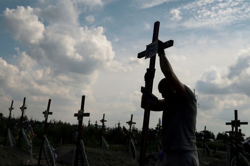 FILE PHOTO: Mass burial of unidentified people killed during Russian invasion in Bucha