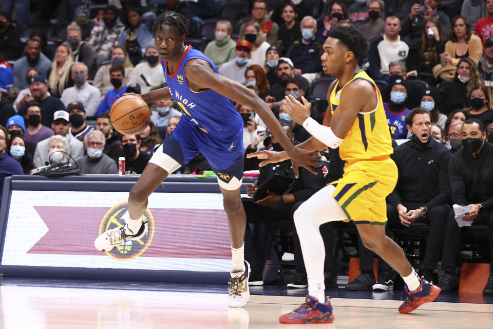 Bol Bol #10 of the Denver Nuggets goes to the basket against Trent Forrest #3 of the Utah Jazz during the second quarter at Ball Arena on January 5, 2022 in Denver, Colorado. (C. Morgan Engel/Getty Images)