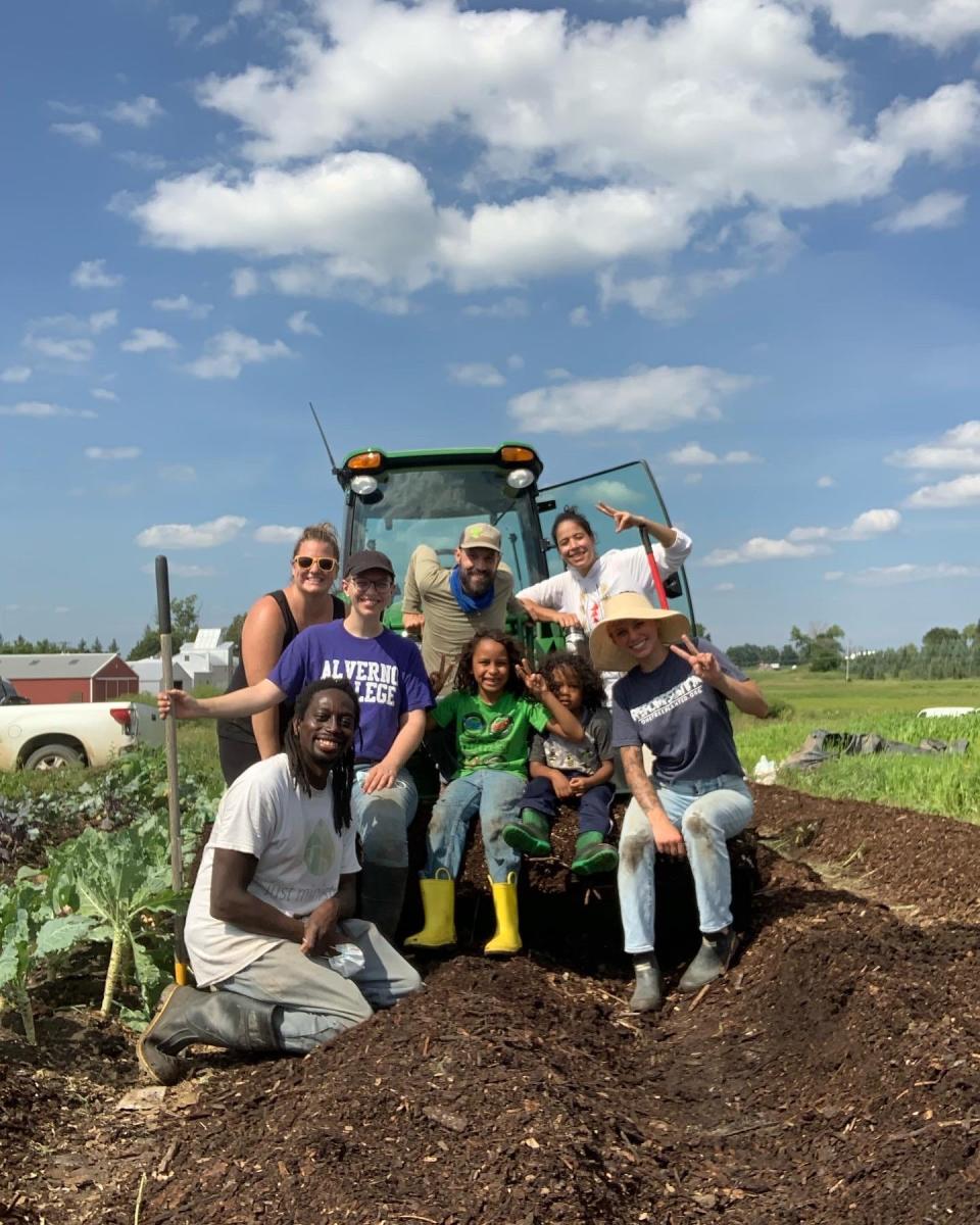 Martice Scales, left, kneeling, is shown with his family and volunteers at Full Circle Healing, a family-owned farm, healing center and apothecary.