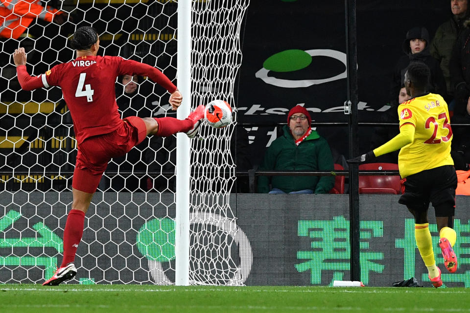 Liverpool's Dutch defender Virgil van Dijk misses a chance at goal during the English Premier League football match between Watford and Liverpool at Vicarage Road Stadium in Watford, north of London on February 29, 2020. (Photo by Justin TALLIS / AFP) / RESTRICTED TO EDITORIAL USE. No use with unauthorized audio, video, data, fixture lists, club/league logos or 'live' services. Online in-match use limited to 120 images. An additional 40 images may be used in extra time. No video emulation. Social media in-match use limited to 120 images. An additional 40 images may be used in extra time. No use in betting publications, games or single club/league/player publications. /  (Photo by JUSTIN TALLIS/AFP via Getty Images)