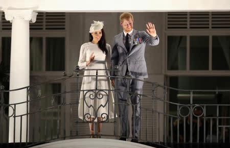 Britain's Prince Harry and Meghan, Duchess of Sussex wave from the balcony of the Grand Pacific Hotel in Suva, Fiji October 23, 2018. Chris Jackson/Pool via REUTERS