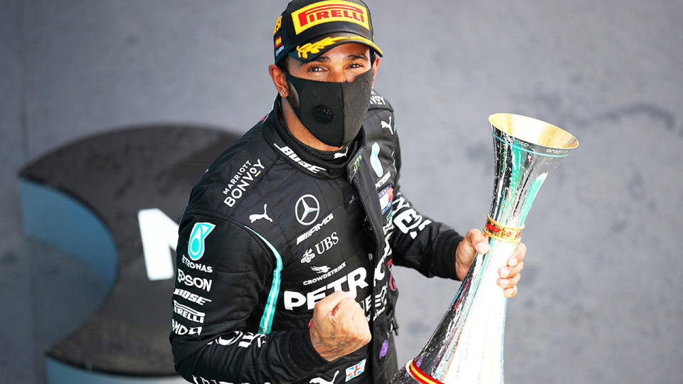 Lewis Hamilton, pictured here celebrating on the podium after winning the Spanish Grand Prix.