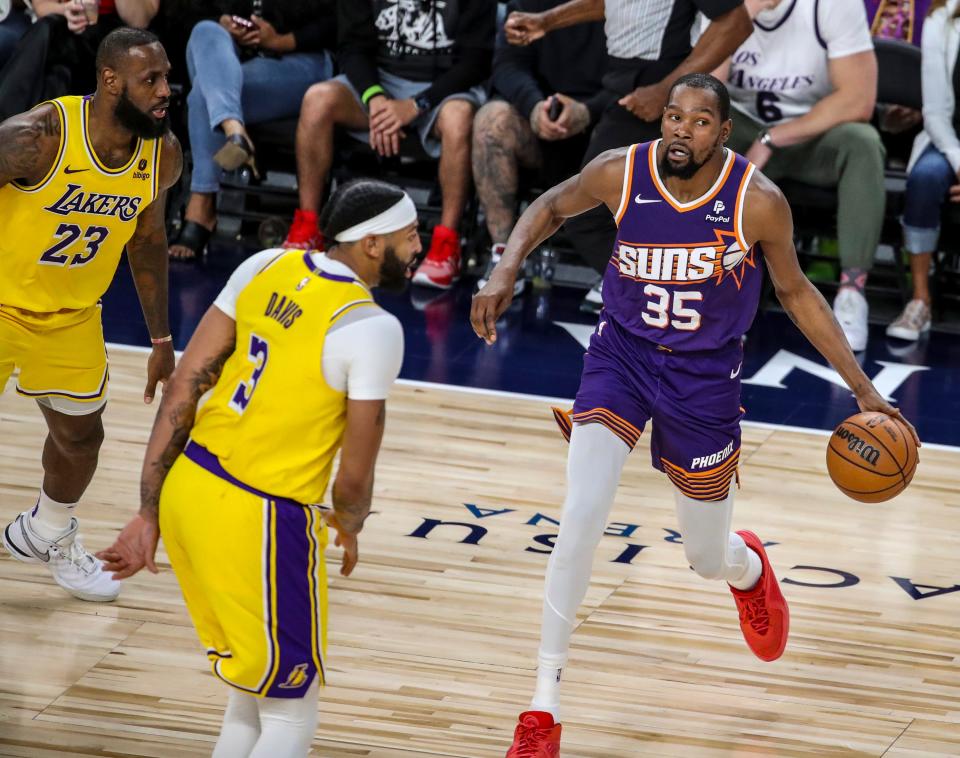 Phoenix Suns forward Kevin Durant (35) looks for an open teammate during the second quarter of their preseason game at Acrisure Arena in Palm Desert, Calif., Thursday, Oct. 19, 2023.