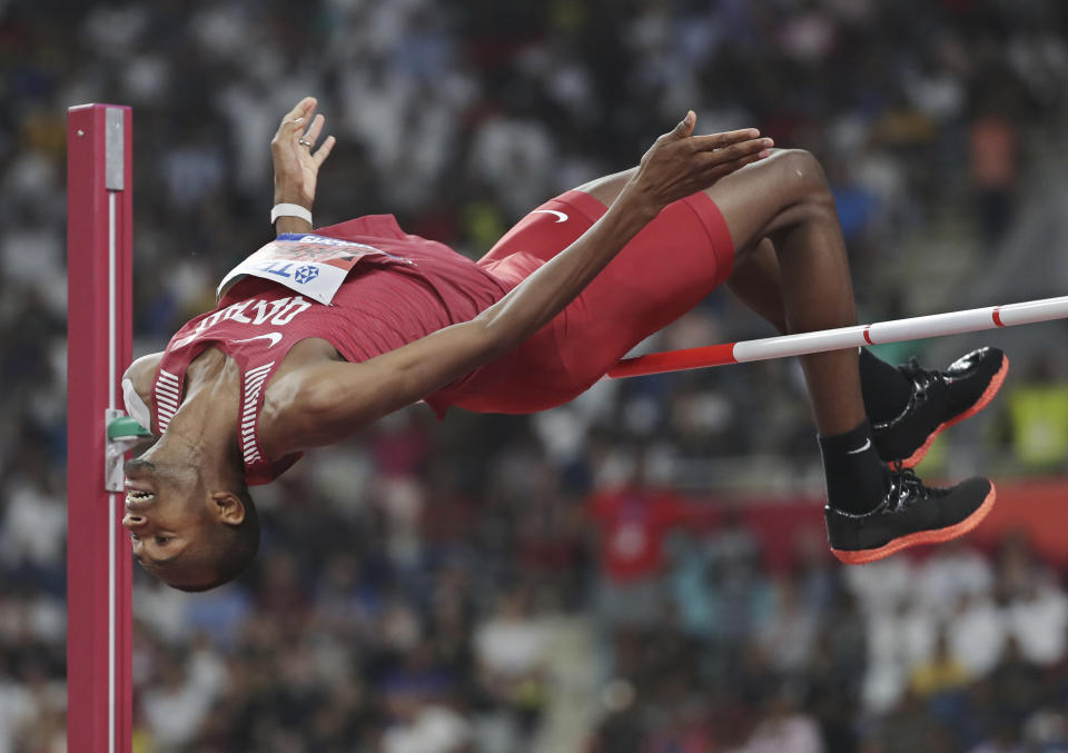 Mutaz Essa Barshim, of Qatar, competes in the men's high jump final at the World Athletics Championships in Doha, Qatar, Friday, Oct. 4, 2019. Barshim won the gold medal. (AP Photo/Hassan Ammar)