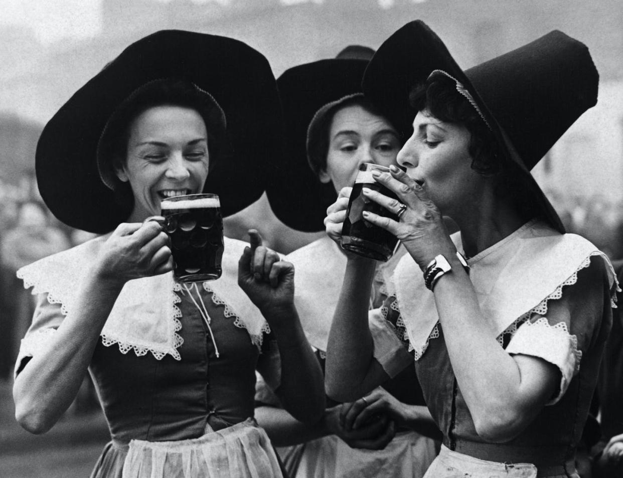 <span class="caption">Three women dressed in Middle-Age period garb as alewives.</span> <span class="attribution"><a class="link " href="https://www.gettyimages.com/detail/news-photo/barmaids-in-costume-from-the-festival-inn-east-london-which-news-photo/613511756?adppopup=true" rel="nofollow noopener" target="_blank" data-ylk="slk:Hulton-Deutsch Collection/Corbis via Getty Images;elm:context_link;itc:0;sec:content-canvas">Hulton-Deutsch Collection/Corbis via Getty Images</a></span>