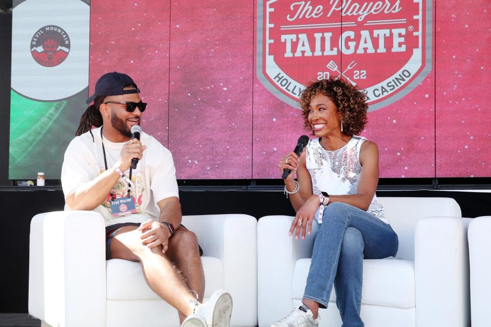 Fred Warner and Sage Steele speak onstage during the Players Tailgate by Bullseye Event Group on February 13, 2022 in Los Angeles, California.