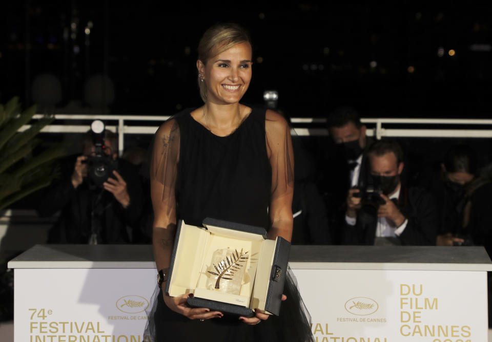 Director Julia Ducournau, winner of the Palme d'Or for the film 'Titane' poses for photographers during a photo call following the awards ceremony at the 74th international film festival, Cannes, southern France, Saturday, July 17, 2021. (Photo by Vianney Le Caer/Invision/AP)