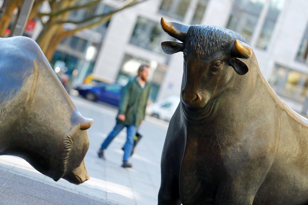 Bull and bear, symbols for successful and bad investing are seen in front of the German stock exchange (Deutsche Boerse) in Frankfurt, Germany, March 25, 2020. REUTERS/Ralph Orlowski