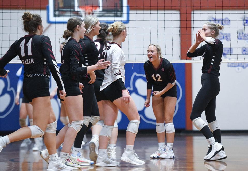 The Royals celebrate winning the Baker vs Jay 1-1A District Tournament championship volleyball match at Jay High School on Thursday, Oct. 19, 2023.