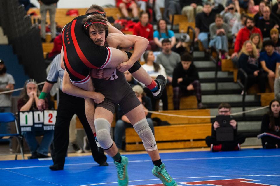 Red Hook's Rian Kirker, bottom, wrestles Port Jervis' Justin Harrison in the 126 pound weight class during the division 2 Section 9 wrestling championship at SUNY Ulster in Stone Ridge, NY on Sunday, February 12, 2023. Red Hook's Rian Kirker won the match.