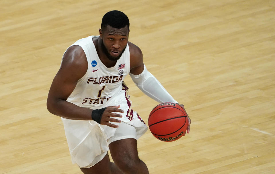 Mar 20, 2021; Indianapolis, Indiana, USA; Florida State Seminoles forward RaiQuan Gray (1) dribbles the ball against the UNCG Spartans during the second half in the first round of the 2021 NCAA Tournament at Bankers Life Fieldhouse.