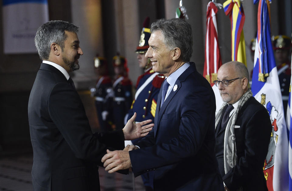 Argentina's President Mauricio Macri, front right, shakes hands with Paraguay's President Mario Abdo Benitez at the Mercosur Summit in Santa Fe, Argentina, Wednesday, July 17, 2019. The South American trading bloc that includes founding members Brazil, Argentina, Paraguay, and Uruguay, is one of the world's largest. (AP Photo/Gustavo Garello)