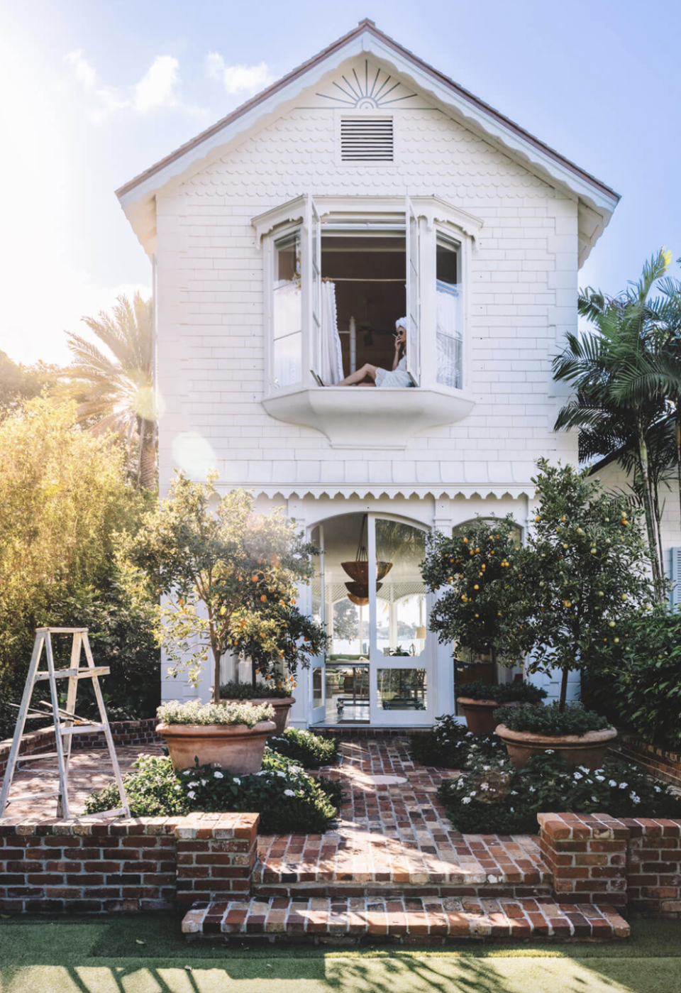 a white house with a ladder