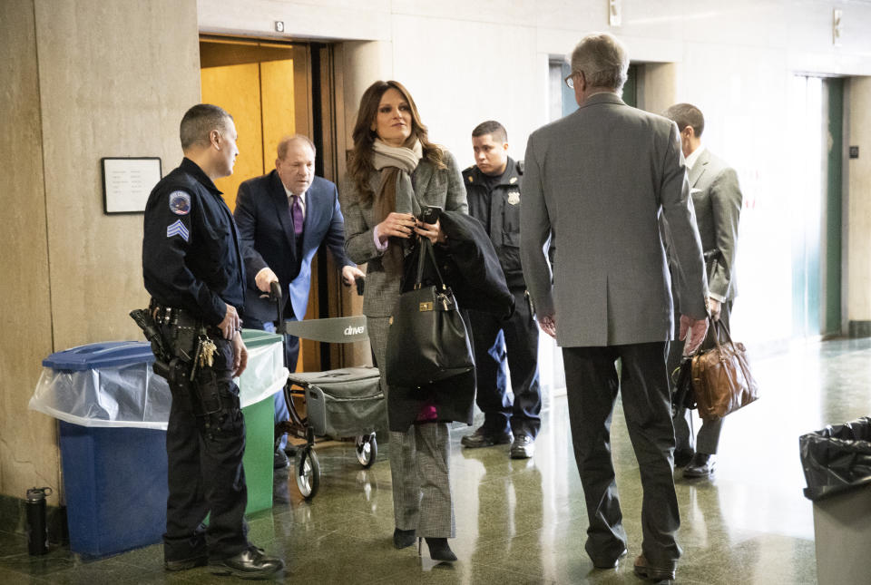 Attorney Donna Rotunno, center, arrives with her client Harvey Weinstein, second from left, for his trial on charges of rape and sexual assault, Monday, Jan. 27, 2020, in New York. (AP Photo/Mark Lennihan)