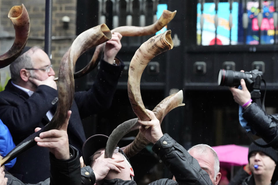 Jewish people and sympathisers blow shofars (ram's horns of spiritual significance) and whistles in London, Sunday, March 10, 2024 to show solidarity with the 100 plus hostages held in Gaza. The 'blow' lasted for 1.55 minutes marking the 155 days they have spent in captivity. (AP Photo/Frank Augstein)