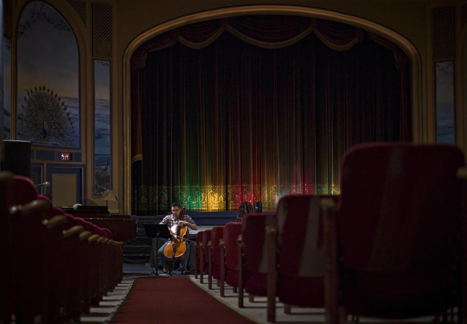 Nick Simons rehearses on his cello for a concert later that afternoon. The venue has been running continuously since it opened and hosts a variety of entertainment including concerts and vaudeville to the town's 13,000 people. (Reuters)