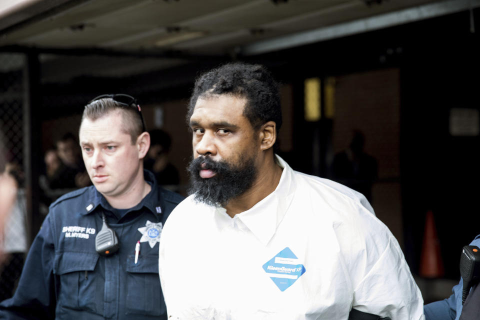 Ramapo police officers escort Grafton Thomas, the suspect arrested for the Monsey stabbing attack, from Ramapo Town Hall to a police vehicle, Sunday, Dec. 29, 2019. Grafton is facing federal hate crime charges in addition to five counts of attempted murder. (Photo: Julius Constantine Motal / Associated Press)