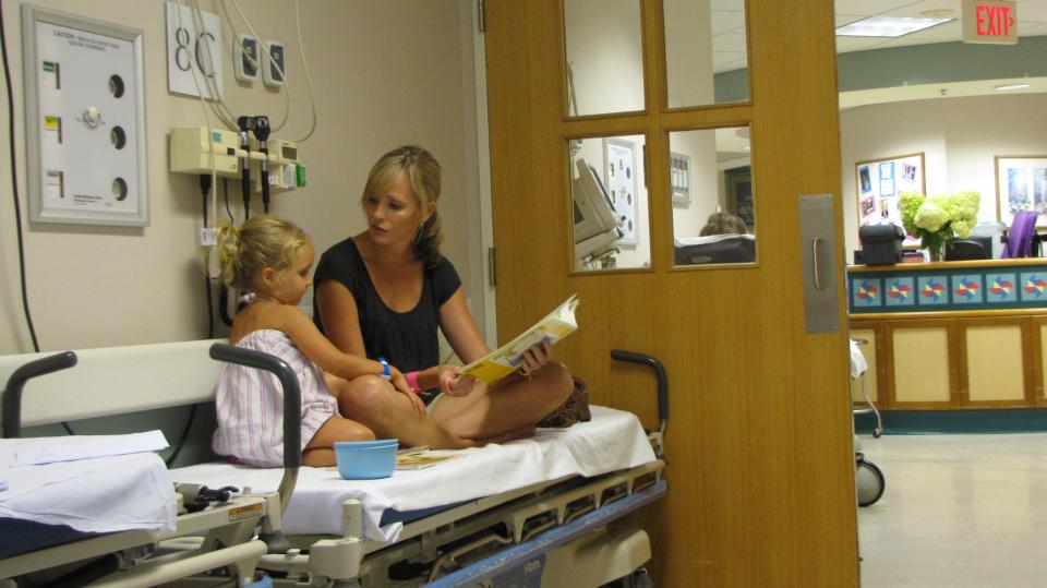 Mom of three, Alison Craytor and daughter Maggie, now age 4, in the UVA ER last fall. Maggie fell while chasing her older brother Luke to give him kiss. She got 2 stitches in her chin   