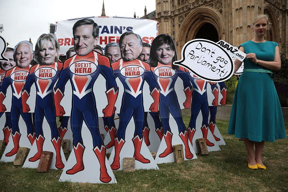 Cardboard cutouts of MPs Tom Tugendhat, Robert Neill, Anna Soubry, Dominic Grieve, Kenneth Clarke, Nicky Morgan, Stephen Hammond and Jeremy Lefroy are presented by pressure group Avaaz as they stage a Brexit vote protest urging the twelve Tory rebels to step up and be superheroes to save the country from Brexit at the House of Commons on June 20, 2018 in London. (Photo by Dan Kitwood/Getty Images)