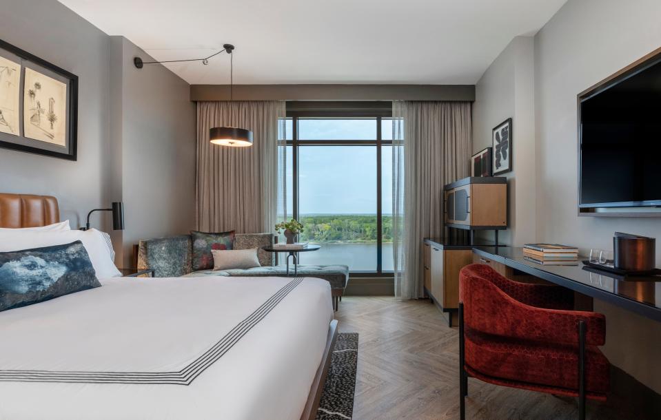 A river-front guest room in Thompson Savannah boasts floor-to-ceiling windows for optimal views of the water.