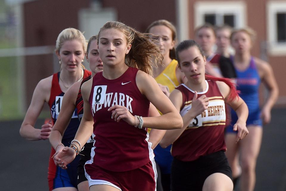 Newark's Nadia Liesen leads a pack of runners in the 1,600 during the Licking Valley Invitational on Thursday, April 28, 2022. Licking Valley track and field hosted Newark, Heath, Lakewood, Licking Heights, and others in the annual event. Liesen won the event with a time of 5:33.05.