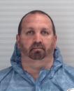 Craig Stephen Hicks, 46, of Chapel Hill appears in a police booking photograph provided by the Durham County Sheriff in Durham, North Carolina February 11, 2015. Hicks has been arrested and charged with fatally shooting three people near the University of North Carolina at Chapel Hill campus on Tuesday, police said. The victims were named by the University of North Carolina as Deah Shaddy Barakat, 23, his wife Yusor Mohammad, 21 and her sister, Razan Mohammad Abu-Salha, 19. (REUTERS/Durham County Office of the Sheriff)