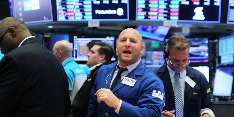 Traders work on the floor of the New York Stock Exchange (NYSE) near the close of market in New York, U.S., October 31, 2018. REUTERS/Brendan McDermid