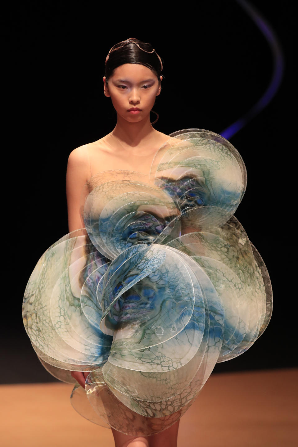 A model wears a creation for Iris van Herpen Haute Couture Spring/Summer 2020 fashion collection presented Monday Jan.20, 2020 in Paris (AP Photo/Michel Euler)