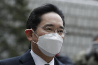 Samsung Electronics Vice Chairman Lee Jae-yong arrives at the Seoul High Court in Seoul, South Korea, Monday, Jan. 18, 2021. South Korean court sentences Lee to 2 and a half years in prison over corruption case. (AP Photo/Lee Jin-man)