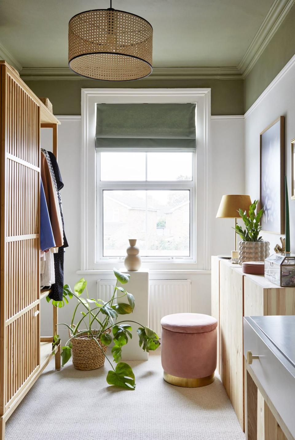 an open wardrobe from ikea gives georgina easy access to her clothes in this compact room a habitat dresserand homesense pouffe are similarly economical buys the blind is homemade, the carpet is from tapi and the natural cane pendant came from madecom