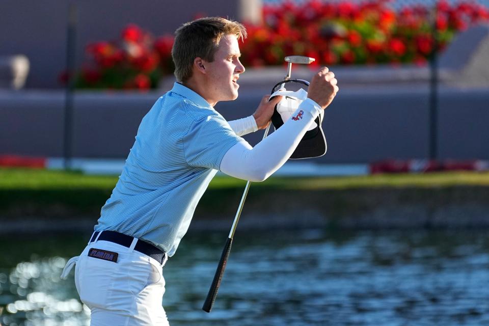 Florida golfer John DeBois, right, celebrates winning his match 1 up against Georgia Tech golfer Connor Howe after during the final round of the NCAA college men's match play golf championship, Wednesday, May 31, 2023, in Scottsdale, Ariz.  (AP Photo/Matt York)