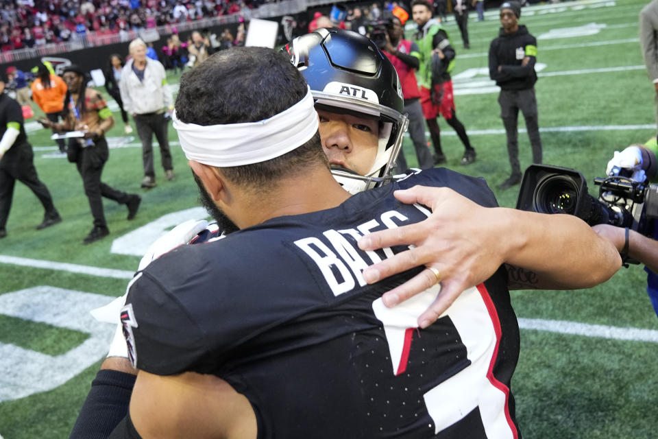 Atlanta Falcons place-kicker Younghoe Koo (6) celebrates with Atlanta Falcons safety Jessie Bates III (3) after an NFL football game against the Houston Texans in Atlanta, Sunday, Oct. 8, 2023. (AP Photo/John Bazemore)