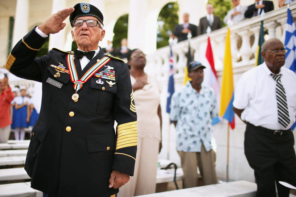 U.S. Army veteran Andres Vergara, 90, of Clearwater, Florida, salutes during the commemoration of the 59th anniversary of the Korean War Armistice at Arlington National Cemetery July 27, 2012 in Arlington, Virginia. With four official combat jumps, paratrooper Vergara received the South Korean medal of honor for rescuing 100 children from an orphanage during the war. (Photo by Chip Somodevilla/Getty Images)