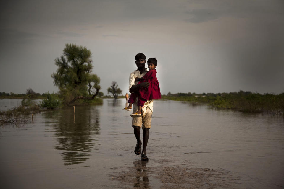 On Sept. 11, 2011, a man carries his daughter across an expanse of flood water in the city of Digri, in Sindh Province. By Sept. 26&nbsp;in Pakistan, over 5.4 million people, including 2.7 million children,&nbsp;had been affected by monsoon rains and flooding, and this number was expected to rise. In Sindh Province, 824,000 people have been displaced and at least 248 killed. Many government schools have been turned into temporary shelters, and countless water sources have been contaminated. More than 1.8 million people are living in makeshift camps without proper sanitation or access to safe drinking water. Over 70 per cent of standing crops and nearly 14,000 livestock have been destroyed in affected areas, where 80 per cent of the population relies on agriculture for food and income. Affected communities are also threatened by measles, acute watery diarrhoea, hepatitis and other communicable diseases. The crisis comes one year after the country&iuml;&iquest;&frac12;s 2010 monsoon-related flooding disaster, which covered up to one fifth of the country in flood water and affected more than 18 million people, half of them children. Many families are still recovering from the earlier emergency, which aggravated levels of chronic malnutrition and adversely affected primary school attendance, sanitation access and other child protection issues. In response to this latest crisis, UNICEF is working with Government authorities and United Nations agencies and partners to provide relief. Thus far, UNICEF-supported programmes have immunized over 153,000 children and 14,000 women; provided nutritional screenings and treatments benefiting over 2,000 children; provided daily safe drinking water to 106,700 people; and constructed 400 latrines benefiting 35,000 people. Still, additional nutrition support and safe water and sanitation services are urgently needed. A joint United Nations Rapid Response Plan seeks US$356.7 million to address the needs of affected populations over the next six months.