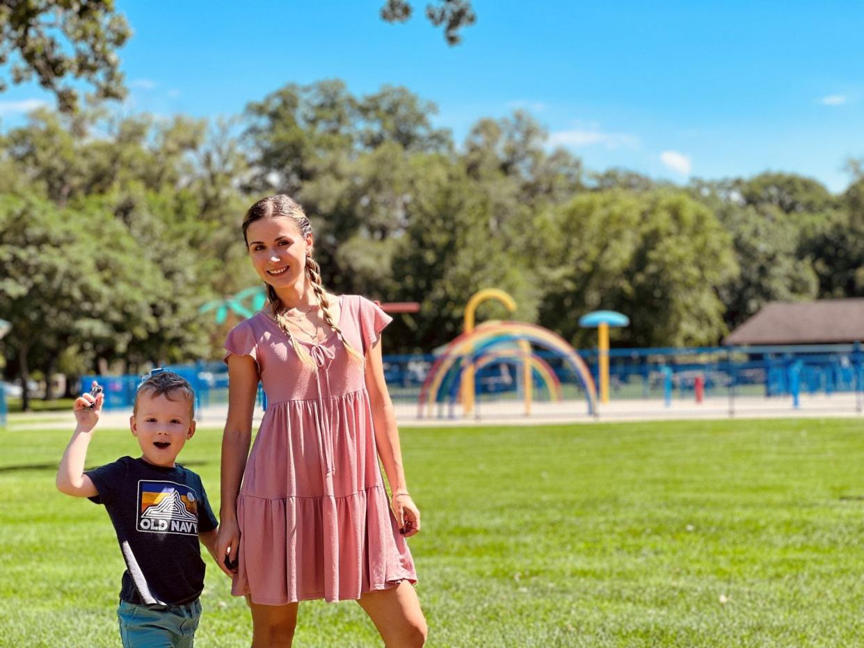 Mom posing for a photo with her son