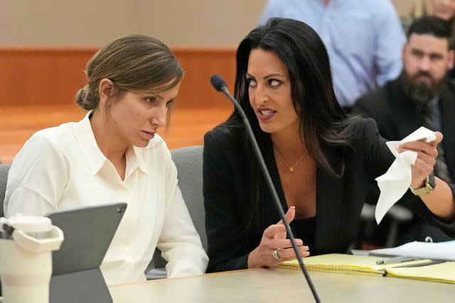 <p>Rick Bowmer/AP</p> Kouri Richins (left) with her lawyer, Skye Lazaro (right) at her bail hearing June 12, 2023, in Park City, Utah.