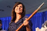 Former U.N. Ambassador Nikki Haley, a potential 2024 presidential contender and former South Carolina governor, receives the Nathan Hale Patriot Award from The Citadel Republican Societ, on Thursday, Dec. 2, 2021, in Charleston, S.C. (AP Photo/Meg Kinnard)