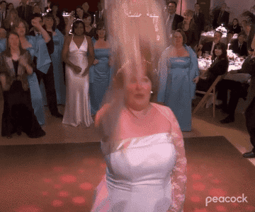 A bride tossing a bouquet to a group of women in The Office