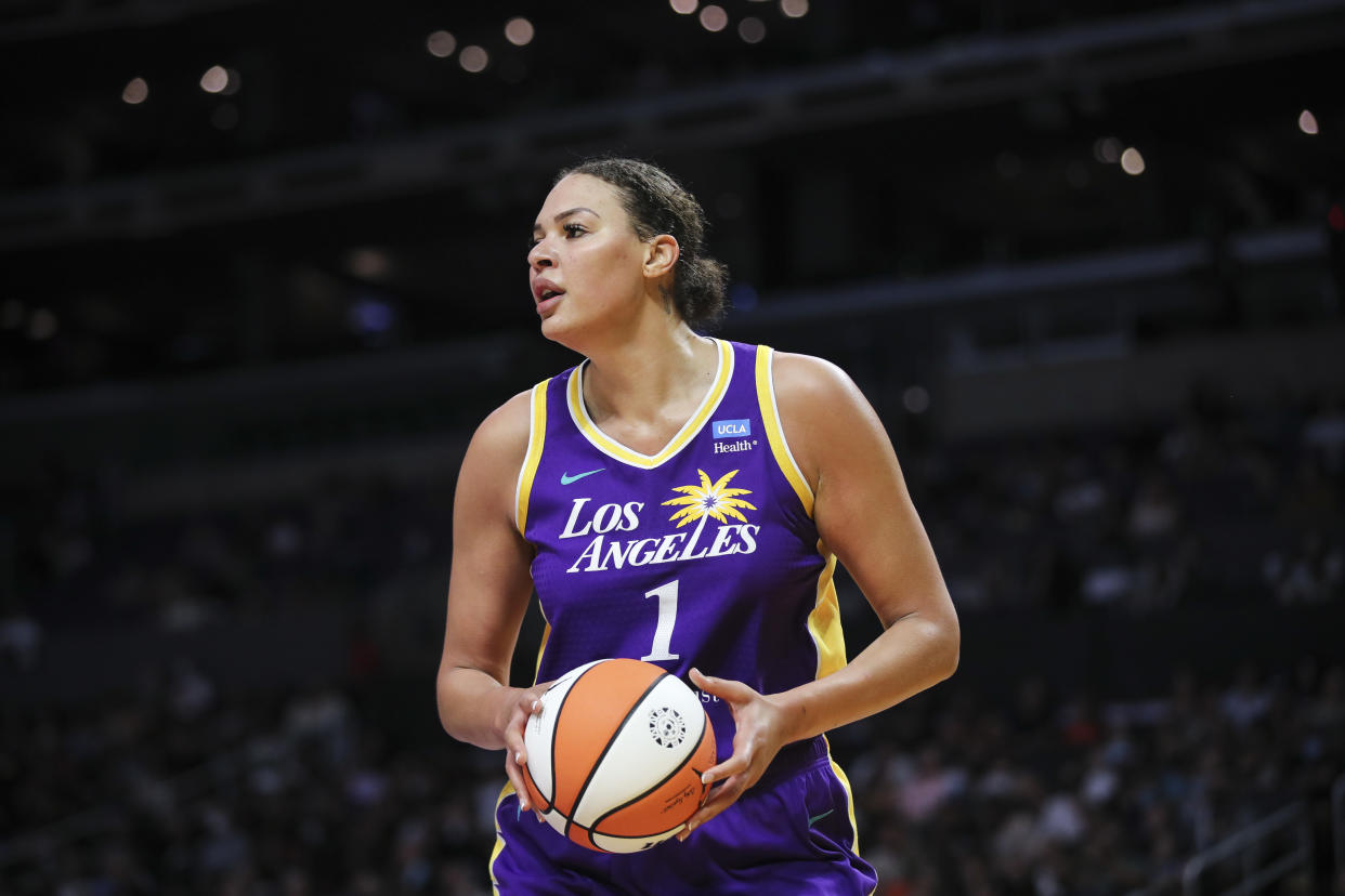 LOS ANGELES, CALIFORNIA - JULY 07: Liz Cambage #1 of the Los Angeles Sparks handles the ball in the first half against the Seattle Storm at Crypto.com Arena on July 07, 2022 in Los Angeles, California. NOTE TO USER: User expressly acknowledges and agrees that, by downloading and or using this photograph, User is consenting to the terms and conditions of the Getty Images License Agreement. (Photo by Meg Oliphant/Getty Images)