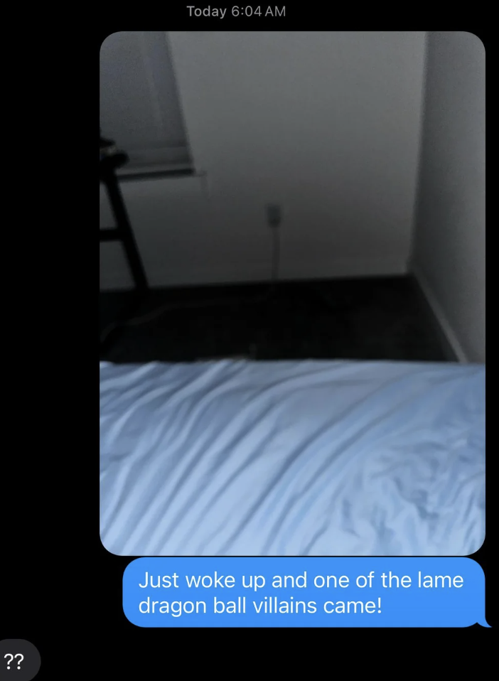 A dimly lit room with a bed in the foreground and a figure resembling a 'Dragon Ball' character edited into the scene. Text overlay denotes surprise at the visit