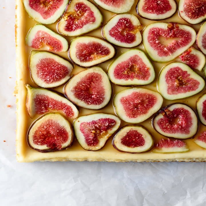 A cheesecake topped with figs,