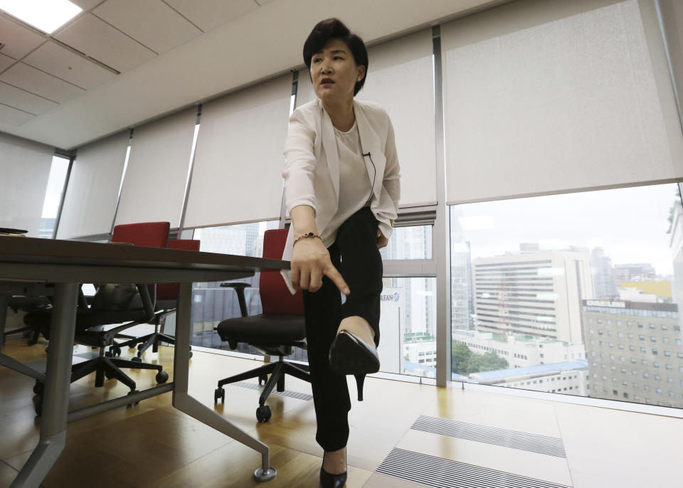 In this Aug. 28, 2018, photo, North Korean defector Kim Jungah gestures while speaking about North Korean military goose steps during an interview in Seoul, South Korea. Goose-stepping soldiers are the most spectacular part of North Korea’s massive military parades. Kim, was once proud of her marching but now feels she was physically abused. (AP Photo/Ahn Young-joon)