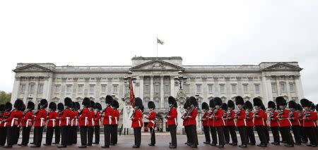 Irish Guards leave Buckingham Palace after forming the honour guard for Britain's Queen Elizabeth during the State Opening of Parliament in London May 9, 2012. REUTERS/Andrew Winning/File Photo